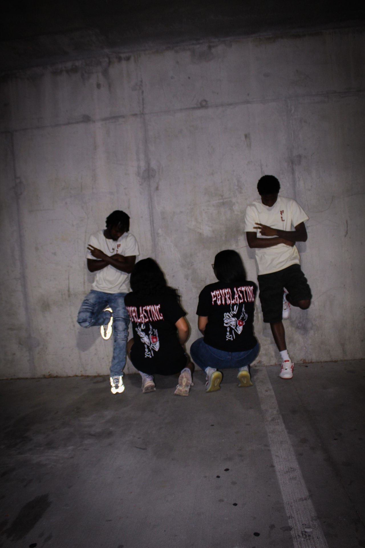 Group shot mixing black and crème F8VRLASTING tees